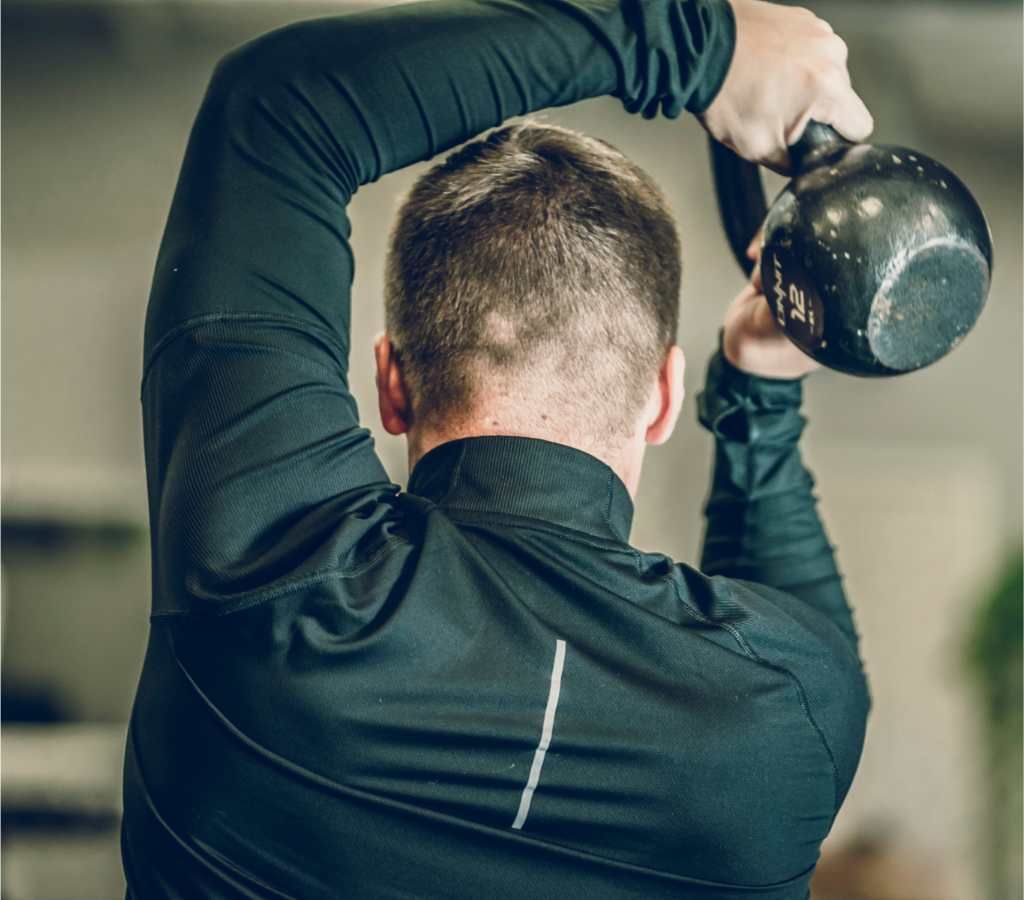 golfer using kettlebell for golf fitness