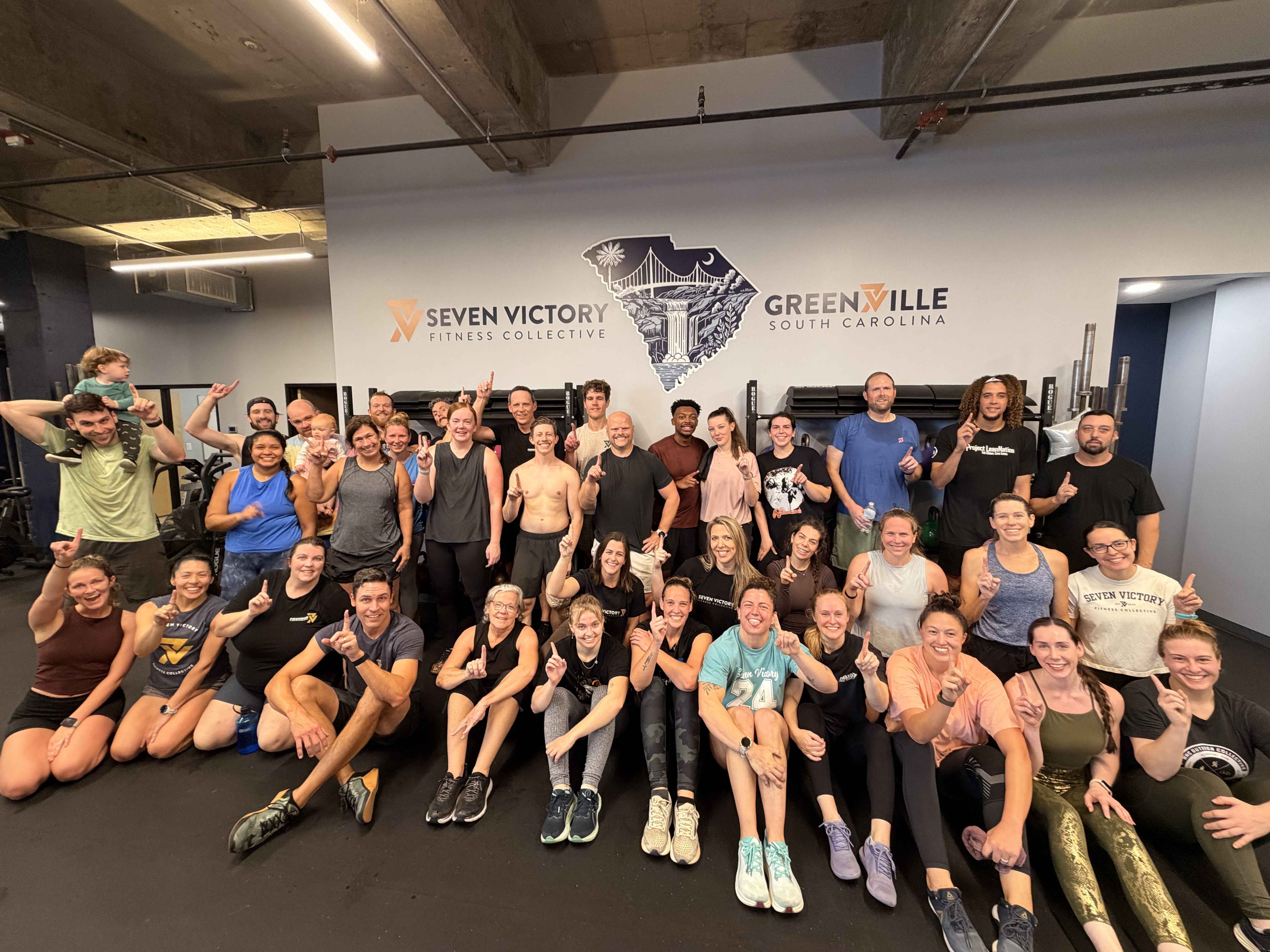 Seven Victory community group photo in the gym