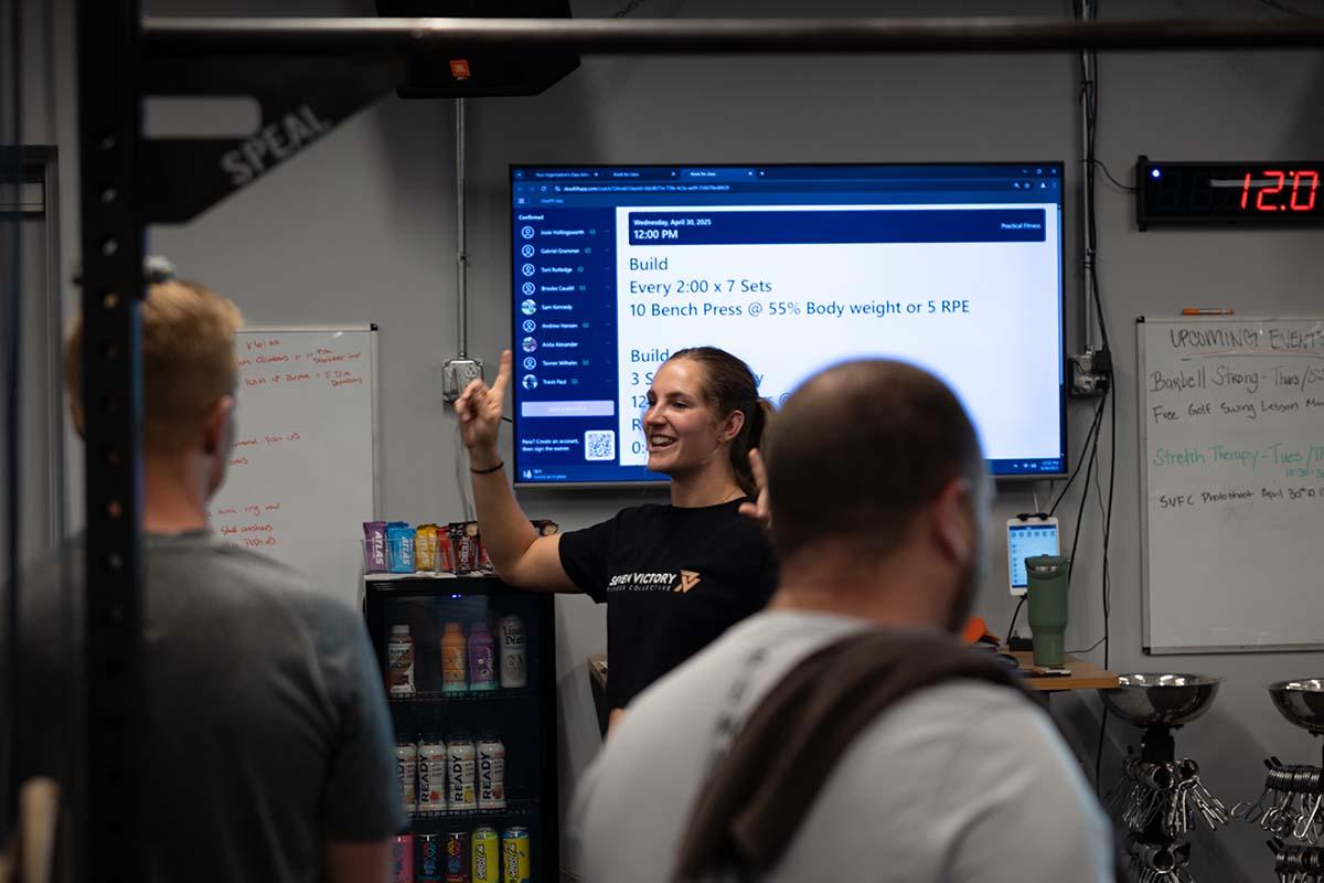 Coach Emily training a client