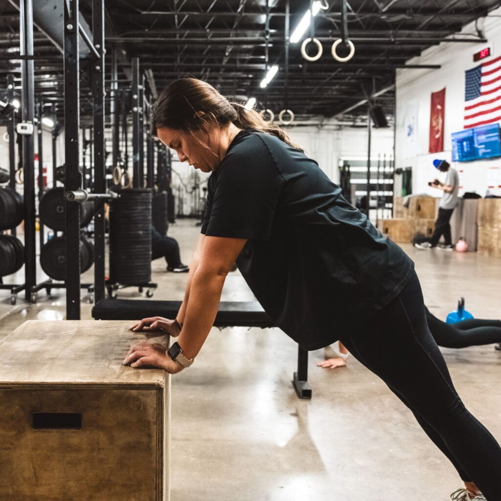 Girl doing a pushup on a box