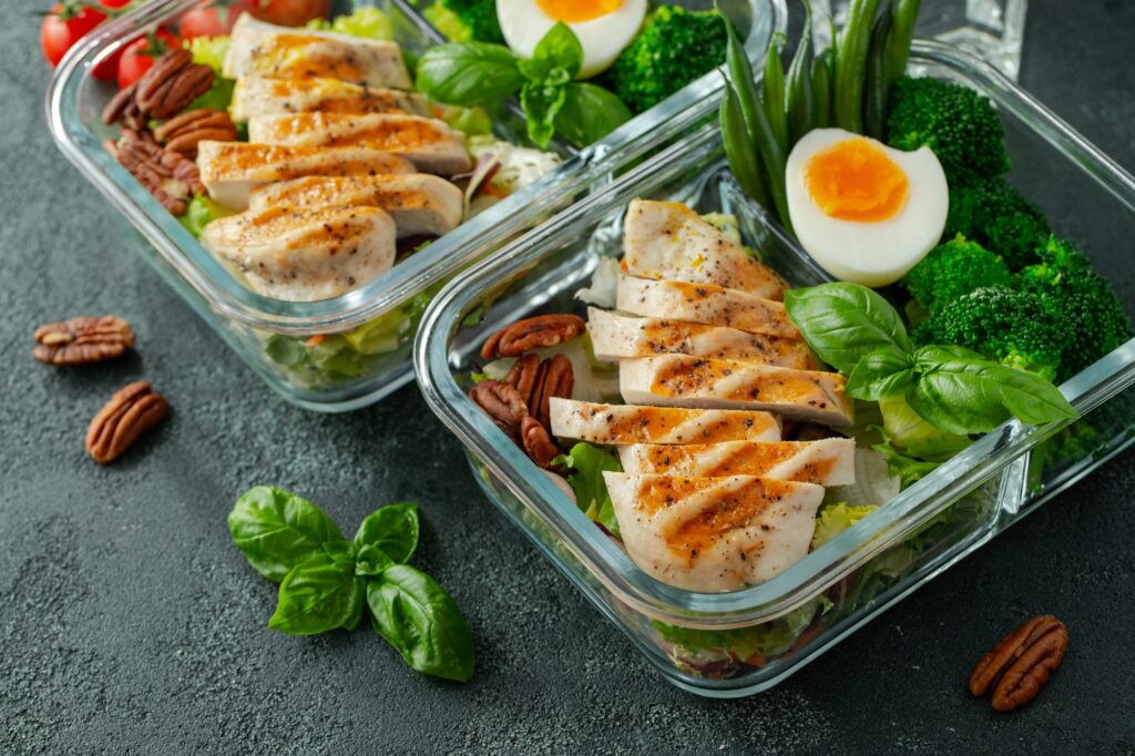 Healthy meal prep containers with chicken breast.